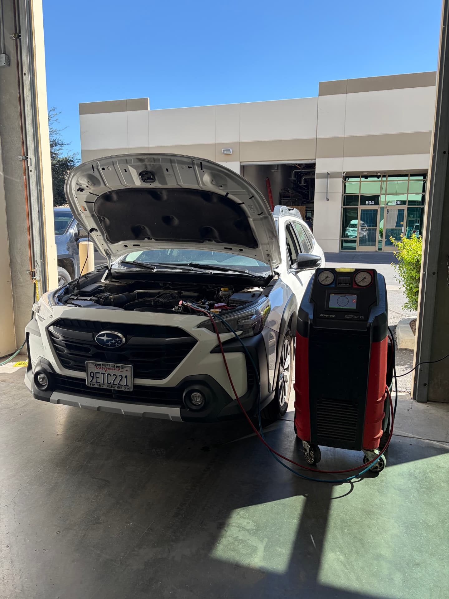 Subaru receiving an R-1234yf air conditioning recharge at Johnny's Auto Repair near Spring Valley Lake in Victorville CA