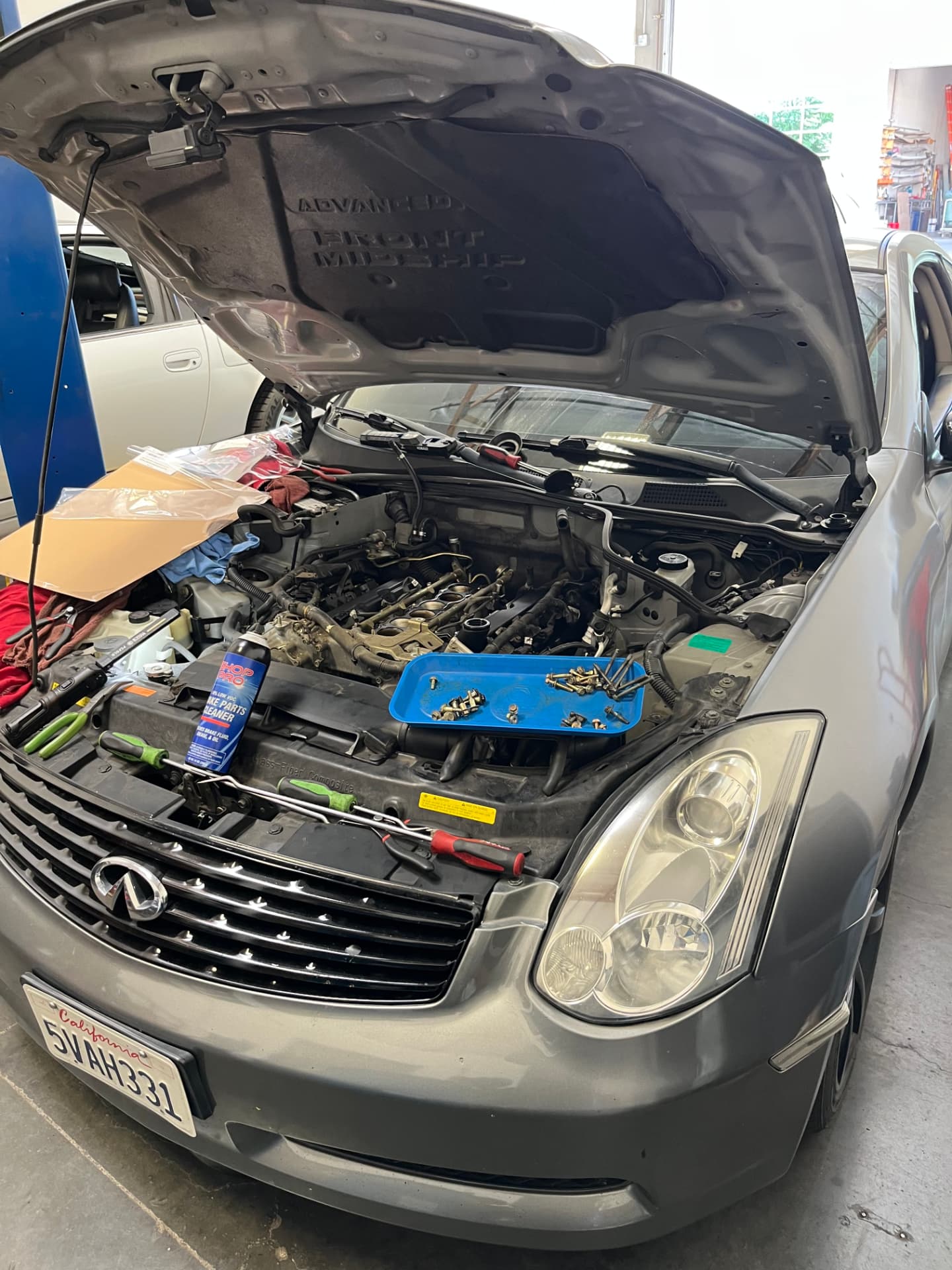 Infiniti undergoing intake manifold replacement at Johnny's Auto Repair near Spring Valley Lake in Victorville CA
